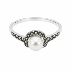 A silver ring featuring a white pearl and small dark stones moving on the band