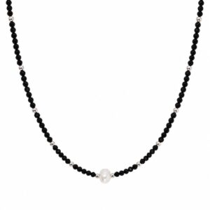 A simple necklace made of a small, smooth black gemstones with a freshwater pearl in the centre