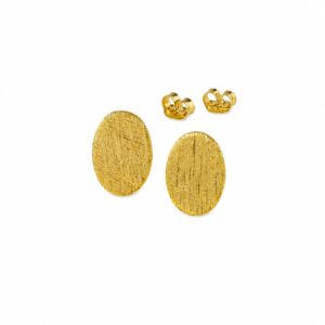 A pair of textured flat gold oval stud earrings showing butterfly backs.