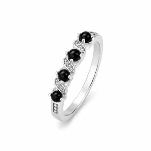 A silver ring featuring round black stones and smaller clear stones.