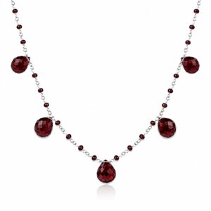 silver chain necklace featuring tiny dark red beads along the chain and larger dangling dark red teardrop stones.