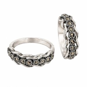 Two silver rings featuring small dark stones.