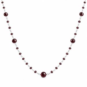 silver chain necklace featuring a pattern of evenly spaced small faceted dark red beads interspersed with larger round faceted dark red beads.