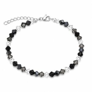 A bracelet featuring alternating black and clear beads, with a lobster claw clasp and an adjustable extender chain.