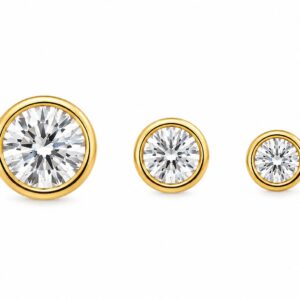 Three gold stud earrings in varying sizes, each featuring a round clear stone
