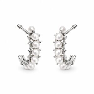 A pair of silver half-hoop earrings featuring a row of pearls flanked by clear stones
