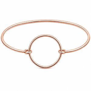 A thin rose gold bangle featuring a central circle design.