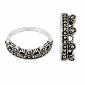 Two silver rings featuring small dark stones.