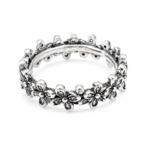Oxidised silver eternity ring with repeating daisies and clear CZ stones