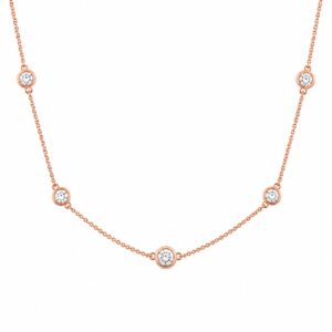 rose gold chain necklace featuring evenly spaced clear stones
